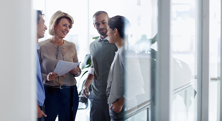 Businesswoman discussing with colleagues